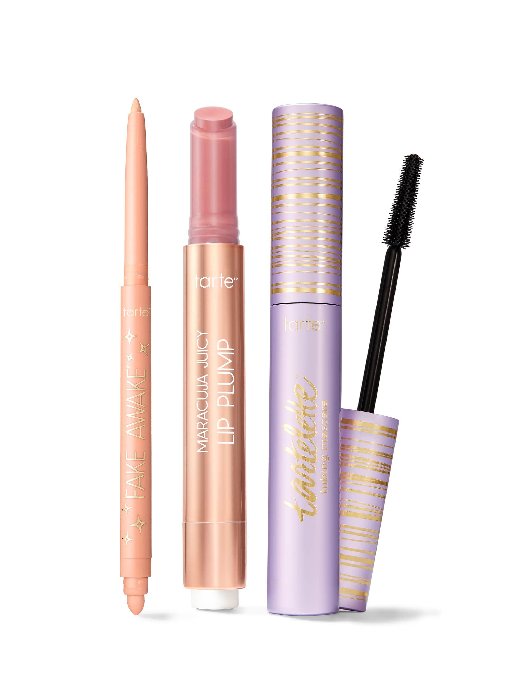 Makeup products including a tarte fake awake eye highlight, maracuja juicy lip plump, and tartelette tubing mascara.